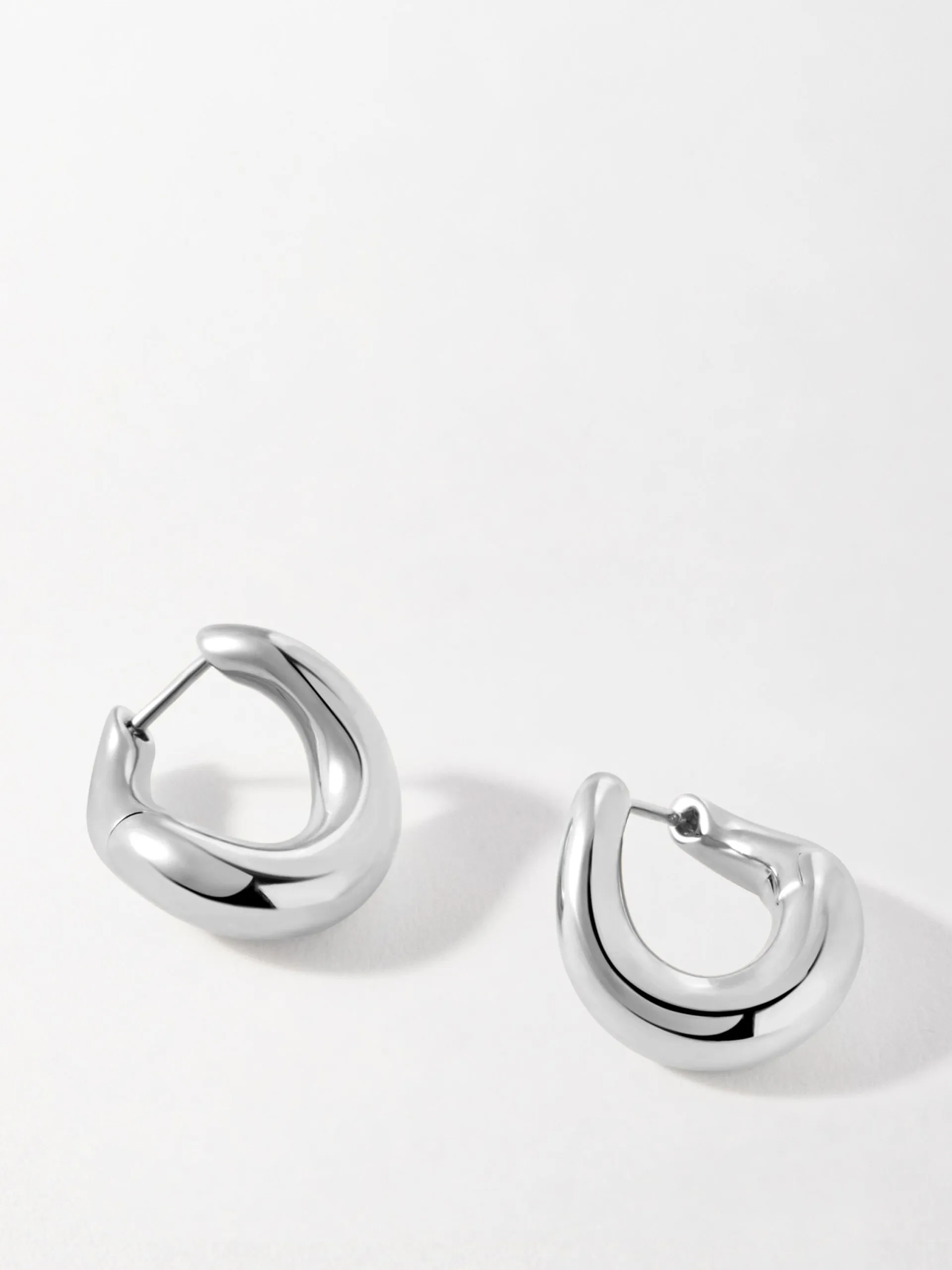 Charlotte Collins twist hoop earrings in silver