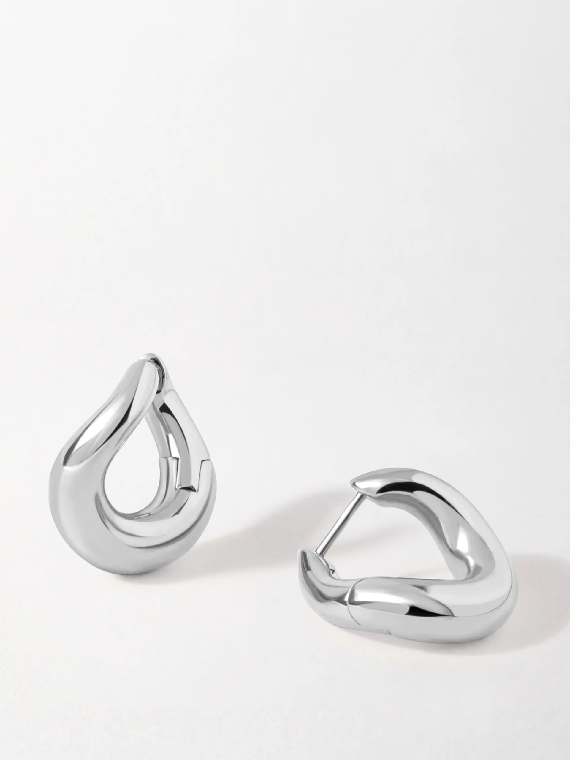 Charlotte Collins twist hoop earrings in silver